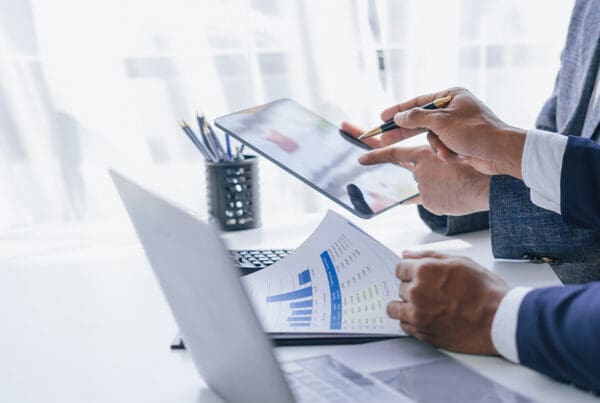 Surety Bonds Offer End-to-End Risk Management Solutions to Protect All Parties in Small Commercial Solar Projects - Using Tablet Pc, Consultant Between Bookkeepers